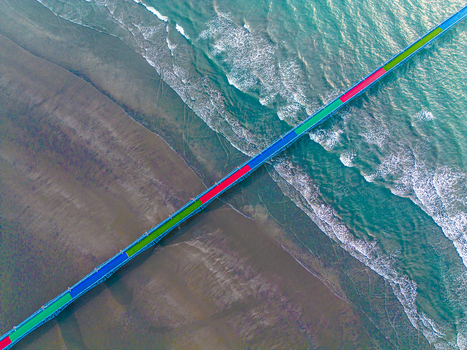Aerial view of the vibrant bridge contrasting with the golden sands and turquoise waters a stunning coastal panorama Cox s Bazar Chittagong Division Bangladesh.