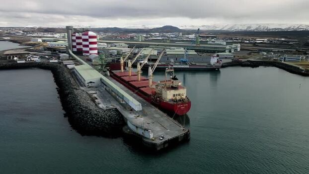 Aerial view of a cargo ship docked at the port in Hafnarfjordur Iceland.