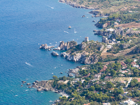 Aerial view of the rugged coastline of Riserva Naturale Orientata dello Zingaro featuring turquoise sea historic watchtower and Mediterranean vegetation San Vito Lo Capo Sicilia Italy. Aerial view of the rugged coastline of Riserva Naturale Orientata dello Zingaro featuring turquoise sea historic watchtower and Mediterranean vegetation San Vito Lo Capo Sicilia Italy.