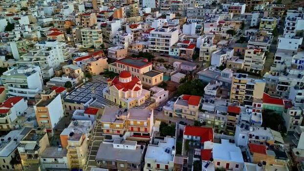 Aerial view of a church with a red dome in Crete Greece.
