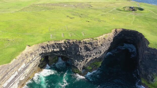 Aerial view of Dun Briste Sea Stack and EIRE 64 sign Ireland. Aerial view of Dun Briste Sea Stack and EIRE 64 sign Ireland.