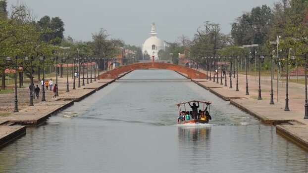 View of the World Peace Pagoda and canal in Lumbini Nepal.