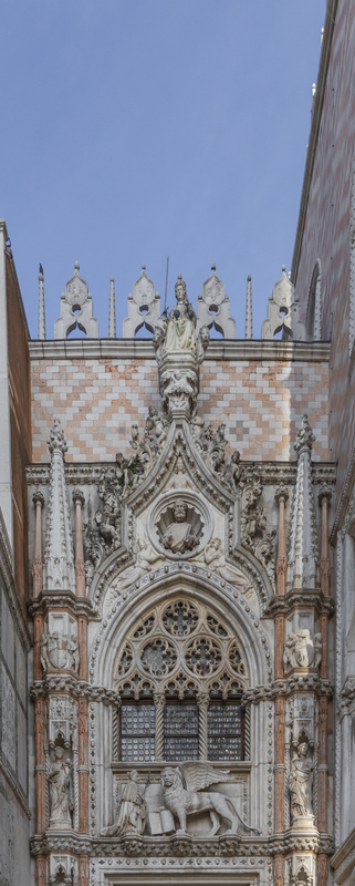 View of the ornate Gothic stone carvings and the winged Lion of Saint Mark at the Porta della Carta entrance of the Doge s Palace in Venice Veneto Italy. View of the ornate Gothic stone carvings and the winged Lion of Saint Mark at the Porta della Carta entrance of the Doge s Palace in Venice Veneto Italy.