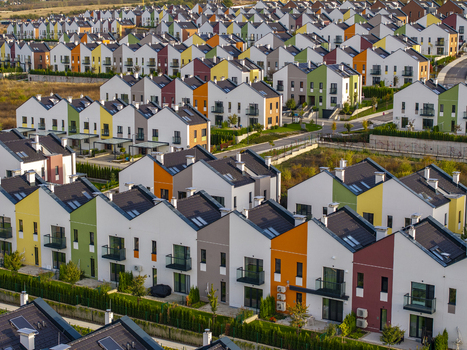 Aerial view of the Residential Park Lozen EOOD housing complex featuring rows of colorful modern townhouses with pitched roofs in Sofia Sofia City Province Bulgaria. Aerial view of the Residential Park Lozen EOOD housing complex featuring rows of colorful modern townhouses with pitched roofs in Sofia Sofia City Province Bulgaria.