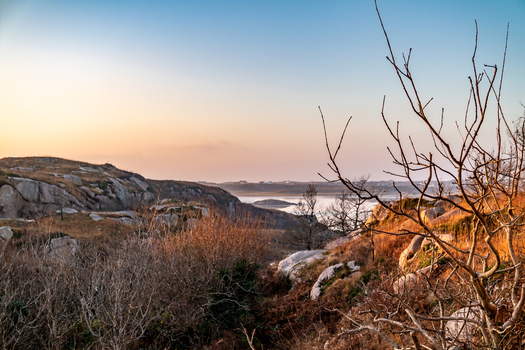 View of the Kincasslagh Mass Rock set within a rugged rocky landscape at golden hour in Kincasslagh County Donegal Ireland. View of the Kincasslagh Mass Rock set within a rugged rocky landscape at golden hour in Kincasslagh County Donegal Ireland.
