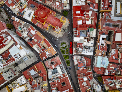 Aerial view of the historic center of Guanajuato Capital featuring the Basilica of Our Lady of Guanajuato surrounded by dense colonial architecture in Guanajuato Guanajuato Mexico. Aerial view of the historic center of Guanajuato Capital featuring the Basilica of Our Lady of Guanajuato surrounded by dense colonial architecture in Guanajuato Guanajuato Mexico.