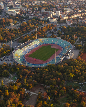Aerial view of Vasil Levski National Stadium surrounded by autumn trees and urban parkland in Sofia Sofia City Province Bulgaria. Aerial view of Vasil Levski National Stadium surrounded by autumn trees and urban parkland in Sofia Sofia City Province Bulgaria.