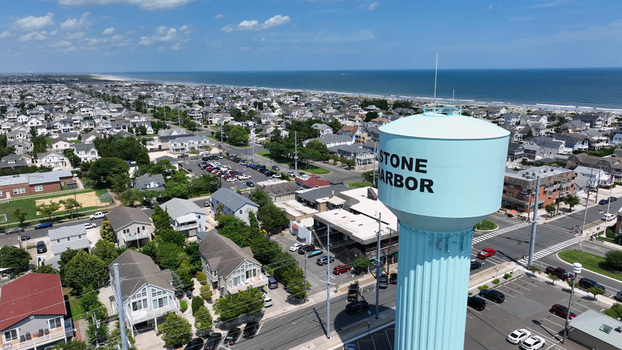 Aerial view of the light blue Stone Harbor water tower overlooking the residential coastal town and the Atlantic Ocean in Stone Harbor New Jersey United States.
