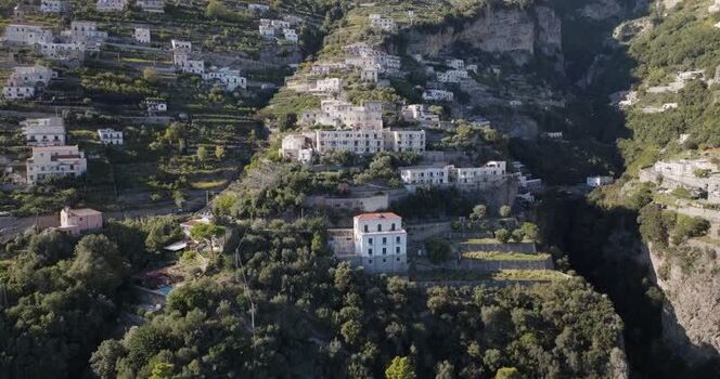 Aerial view of buildings on mountain side Italy. Aerial view of buildings on mountain side Italy.