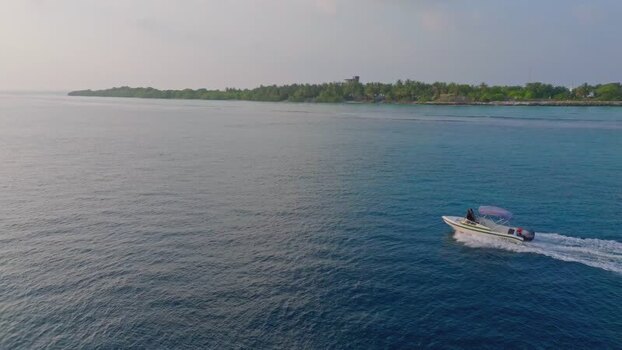 Aerial view of boat near island Maldives.