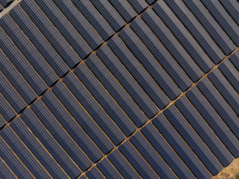 Aerial view of a large solar farm with rows of photovoltaic panels arranged in a geometric pattern in Lovech Lovech Bulgaria. Aerial view of a large solar farm with rows of photovoltaic panels arranged in a geometric pattern in Lovech Lovech Bulgaria.