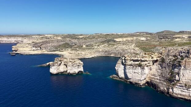Aerial view of Dwejra Bay and limestone cliffs in Gozo Malta. Aerial view of Dwejra Bay and limestone cliffs in Gozo Malta.