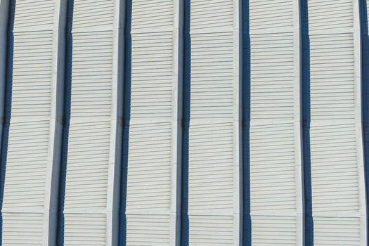 Aerial view of the rhythmic vertical facade of a modern building in Arezzo Tuscany Italy. Aerial view of the rhythmic vertical facade of a modern building in Arezzo Tuscany Italy.