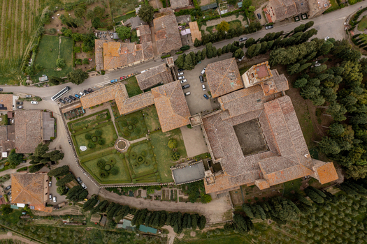 Aerial view of the historic Badia di Passignano with its structured gardens stone buildings and terracotta rooftops in Passignano Toscana Italy. Aerial view of the historic Badia di Passignano with its structured gardens stone buildings and terracotta rooftops in Passignano Toscana Italy.