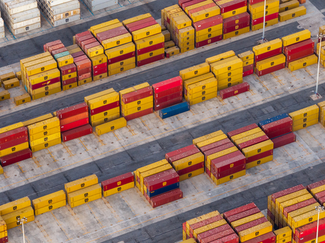 Civitavecchia Italy 22 August 2026 Aerial view of Civitavecchia Port with rows of colorful shipping containers stacked on the concrete terminal ground.