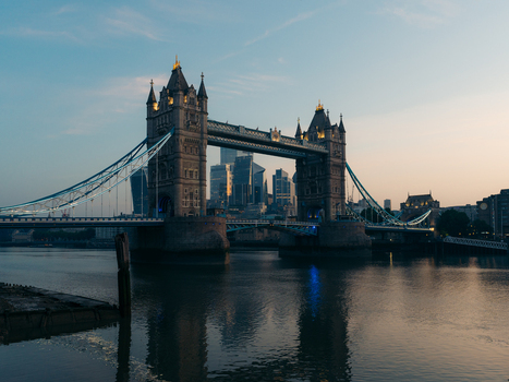 London United Kingdom 20 June 2025 View of the majestic Tower Bridge reflected in the calm waters with the city s modern skyscrapers rising in the soft morning light. London United Kingdom 20 June 2025 View of the majestic Tower Bridge reflected in the calm waters with the city s modern skyscrapers rising in the soft morning light.