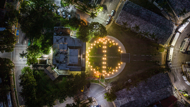 Aerial view of Feria Ganadera illuminated at night with surrounding streets and lush trees in Santo Domingo Distrito Nacional Dominican Republic. Aerial view of Feria Ganadera illuminated at night with surrounding streets and lush trees in Santo Domingo Distrito Nacional Dominican Republic.