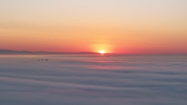 Aerial view of sunrise over clouds near Europa Point Gibraltar.