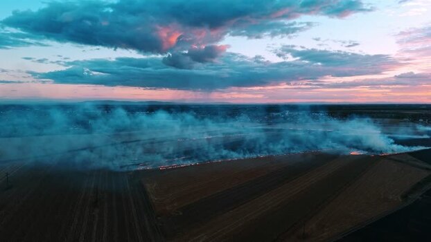 Aerial view of field burning at sunset in Sremska Mitrovica Serbia. Aerial view of field burning at sunset in Sremska Mitrovica Serbia.