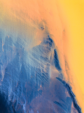 Aerial view of a river delta with dark blue glacial water and golden sediment rich channels forming intricate patterns Iceland. Aerial view of a river delta with dark blue glacial water and golden sediment rich channels forming intricate patterns Iceland.