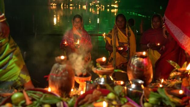 View of women holding oil lamps during a religious ritual Bangladesh. View of women holding oil lamps during a religious ritual Bangladesh.
