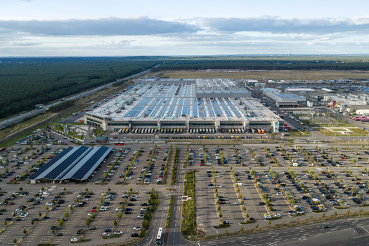 Grunheide Brandenburg Germany 07 September 2026 Aerial view of the Tesla Gigafactory Berlin Brandenburg featuring the massive manufacturing facility and extensive parking lots. Grunheide Brandenburg Germany 07 September 2026 Aerial view of the Tesla Gigafactory Berlin Brandenburg featuring the massive manufacturing facility and extensive parking lots.