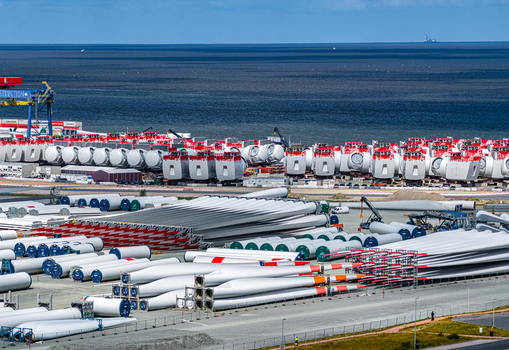 Aerial view of Siemens Gamesa Renewable Energy wind turbine components including blades and nacelles stored at the port in Cuxhaven Niedersachsen Germany.