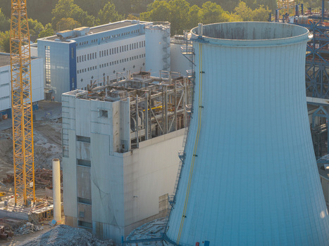 Aerial view of the deconstruction of the Combined Heat and Power Plant Lichterfelde featuring the large cooling tower industrial structures and a construction crane Berlin Berlin Germany. Aerial view of the deconstruction of the Combined Heat and Power Plant Lichterfelde featuring the large cooling tower industrial structures and a construction crane Berlin Berlin Germany.