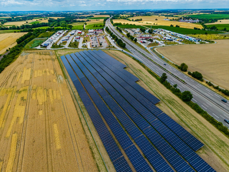 Aerial view of a large solar farm next to Serways Raststatte Hohenlohe Sud highway rest stop and A6 motorway surrounded by fields in Neuenstein Baden Wurttemberg Germany. Aerial view of a large solar farm next to Serways Raststatte Hohenlohe Sud highway rest stop and A6 motorway surrounded by fields in Neuenstein Baden Wurttemberg Germany.