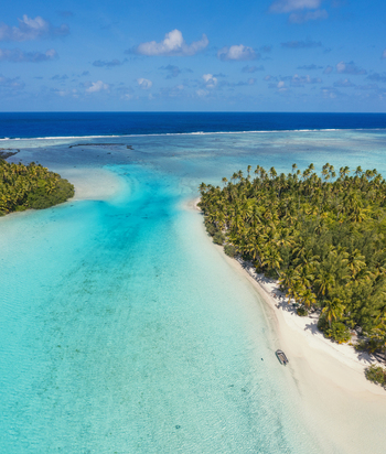 Aerial view of One Foot Island in Aitutaki lagoon with lush palm trees white sand beaches and crystal clear turquoise water in Arutanga Cook Islands. Aerial view of One Foot Island in Aitutaki lagoon with lush palm trees white sand beaches and crystal clear turquoise water in Arutanga Cook Islands.