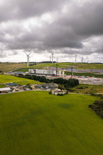 Aerial view of Green Mountain SVG Undheim Datasenter construction site surrounded by wind turbines and green fields in Undheim Rogaland Norway. Aerial view of Green Mountain SVG Undheim Datasenter construction site surrounded by wind turbines and green fields in Undheim Rogaland Norway.