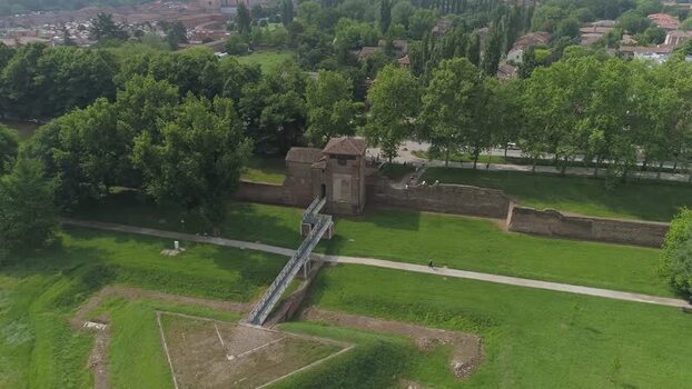 Aerial view of the historic brick city walls and green park Italy. Aerial view of the historic brick city walls and green park Italy.