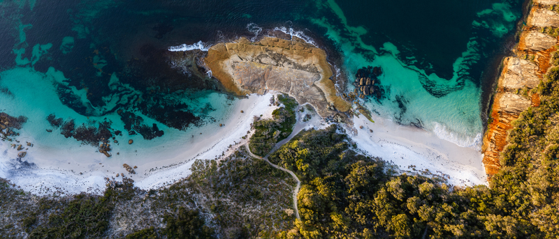 Aerial view of Camp Quaranup featuring rocky coastal outcrops turquoise waters white sand beaches and dense native vegetation Vancouver Peninsula Western Australia Australia. Aerial view of Camp Quaranup featuring rocky coastal outcrops turquoise waters white sand beaches and dense native vegetation Vancouver Peninsula Western Australia Australia.