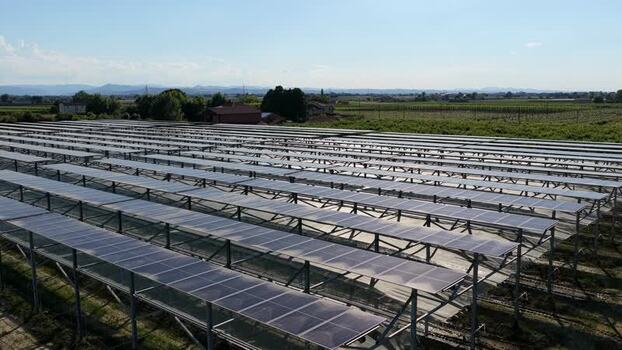 Aerial view of solar farm in rural landscape Italy.