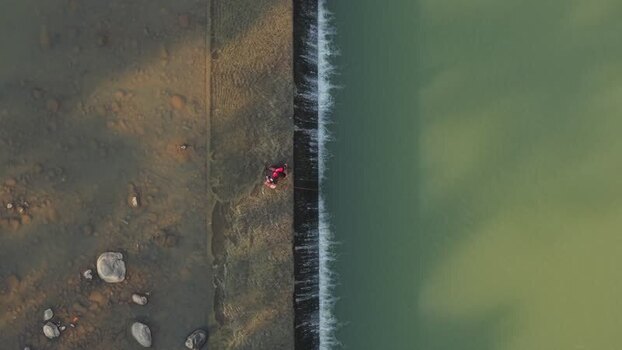 Aerial view of Fisherman at Tangsi River Water Gate in Indonesia. Aerial view of Fisherman at Tangsi River Water Gate in Indonesia.