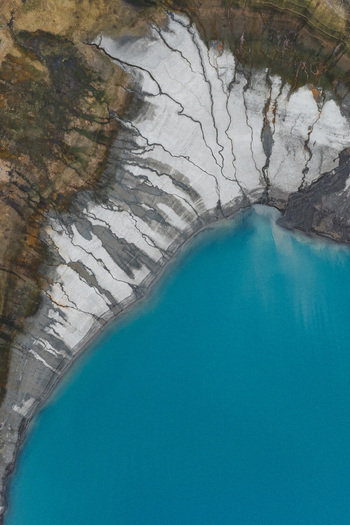 Aerial view of the turquoise glacial waters and sediment patterns of the Alaska Wilderness near Eklutna Alaska United States. Aerial view of the turquoise glacial waters and sediment patterns of the Alaska Wilderness near Eklutna Alaska United States.