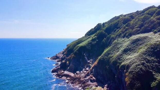 Aerial view of Lantic Bay cliffs in Polruan United Kingdom.