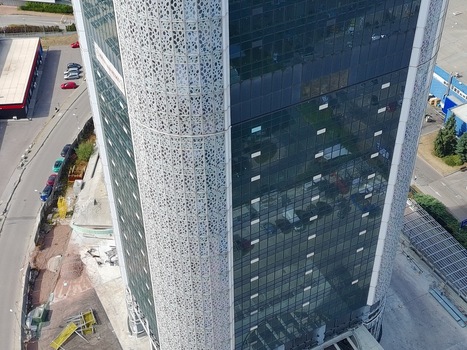 Aerial view of the Millennium Center skyscraper featuring a modern glass facade with intricate geometric patterns in Sofia Sofia City Province Bulgaria. Aerial view of the Millennium Center skyscraper featuring a modern glass facade with intricate geometric patterns in Sofia Sofia City Province Bulgaria.
