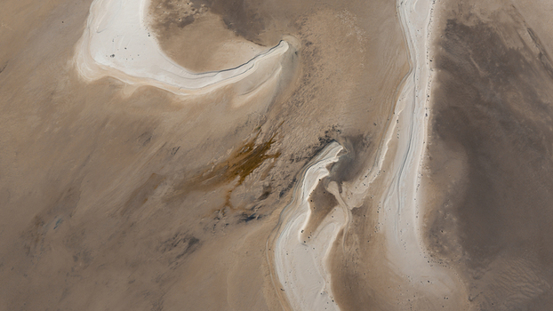 Aerial view of intricate tidal sand patterns and shallow turquoise water along the coastline in Denham Western Australia Australia. Aerial view of intricate tidal sand patterns and shallow turquoise water along the coastline in Denham Western Australia Australia.