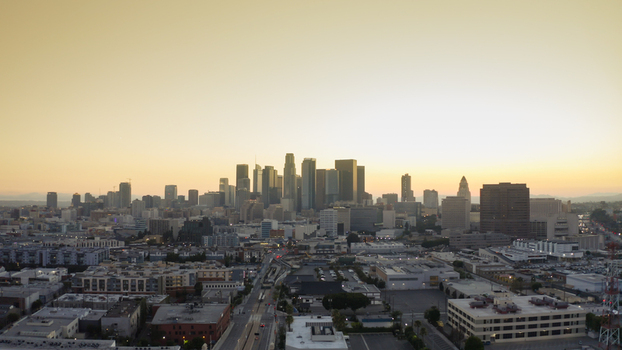 Aerial view of the Los Angeles skyline at sunset with skyscrapers urban sprawl and golden light Los Angeles California United States. Aerial view of the Los Angeles skyline at sunset with skyscrapers urban sprawl and golden light Los Angeles California United States.
