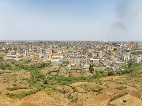 Aerial view of the Lucky Summer neighborhood with dense residential buildings unpaved roads and dry vegetation in Nairobi Nairobi County Kenya. Aerial view of the Lucky Summer neighborhood with dense residential buildings unpaved roads and dry vegetation in Nairobi Nairobi County Kenya.