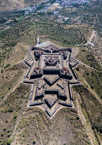 Elvas Portugal 10 September 2026 Aerial view of the star shaped Forte de Nossa Senhora da Graca a historic 18th century fortification set on a hilltop surrounded by olive groves. Elvas Portugal 10 September 2026 Aerial view of the star shaped Forte de Nossa Senhora da Graca a historic 18th century fortification set on a hilltop surrounded by olive groves.