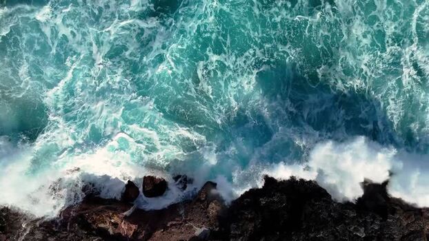 Aerial view of ocean waves crashing on Kalaemamo United States.