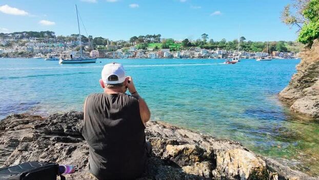 Aerial view of photographer by the river in Fowey United Kingdom.