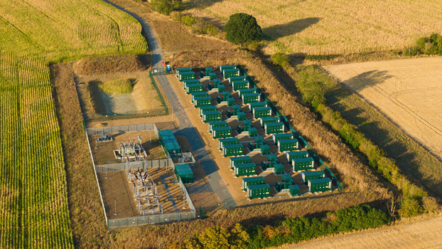 Aerial view of the Battery Energy park BESS Grendon featuring rows of green battery storage containers and electrical infrastructure in Northampton England United Kingdom. Aerial view of the Battery Energy park BESS Grendon featuring rows of green battery storage containers and electrical infrastructure in Northampton England United Kingdom.