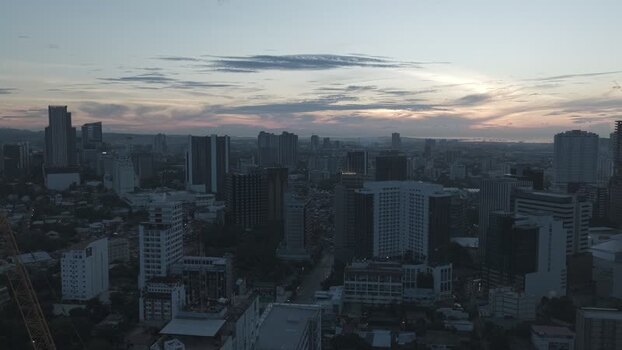 Aerial view of the urban skyline and skyscrapers at dusk Philippines.