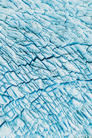 View of the deep blue crevasses and jagged ice formations of the Perito Moreno Glacier in El Calafate Santa Cruz Province Argentina.