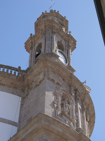 View of the ornate bell tower and clock of the Santuario de la Virgen Peregrina in Pontevedra Pontevedra Spain.