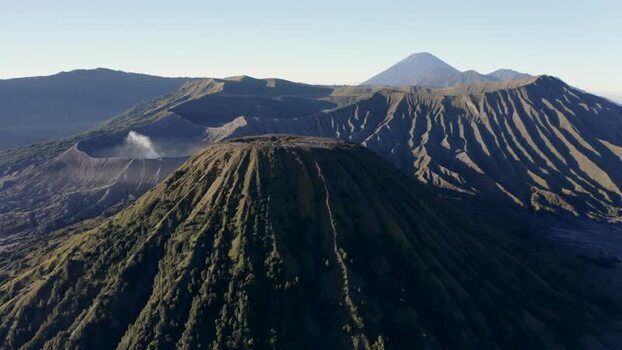 Aerial view of Mount Bromo volcanic craters and rugged peaks Indonesia. Aerial view of Mount Bromo volcanic craters and rugged peaks Indonesia.