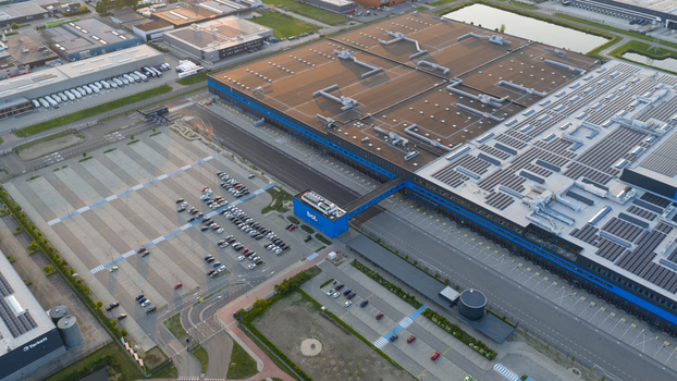 Waalwijk Netherlands 09 May 2026 Aerial view of the Bol distribution center with its massive warehouse rooftops solar panels and large parking lot during sunset. Waalwijk Netherlands 09 May 2026 Aerial view of the Bol distribution center with its massive warehouse rooftops solar panels and large parking lot during sunset.
